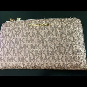 Rose gold Michael Kors wristlet